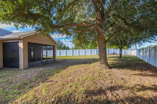 a view of a house with a garden and plants