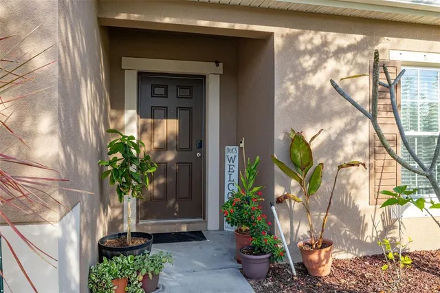 a living room with furniture flat screen tv and wooden floor