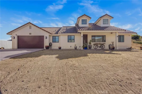 a front view of a house with yard