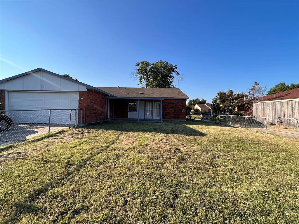 8506 Woodside Road Rowlett, TX 75088 - Photo 1 of 27 a house view with a garden space