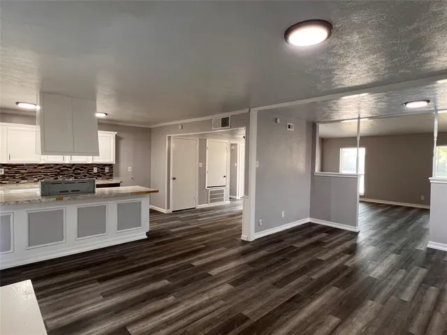 a view of kitchen with wooden floor
