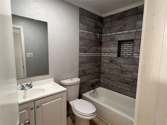 a bathroom with a toilet a sink and shower