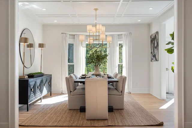 a view of kitchen with stainless steel appliances granite countertop cabinets and wooden floor