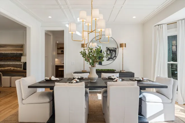 a kitchen with stainless steel appliances granite countertop a sink a stove and a wooden floors