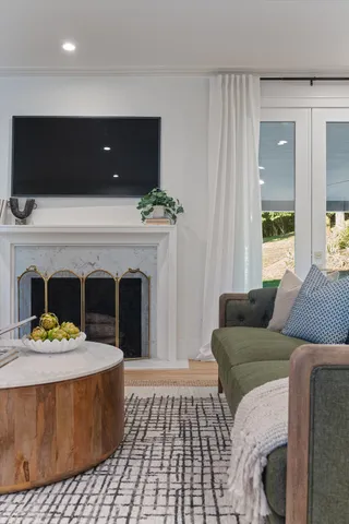 a kitchen with stainless steel appliances granite countertop a stove a sink and a wooden floors