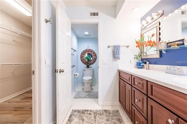 a bathroom with a sink a mirror and a toilet