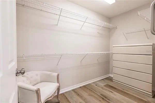 a bathroom with a window and a shower