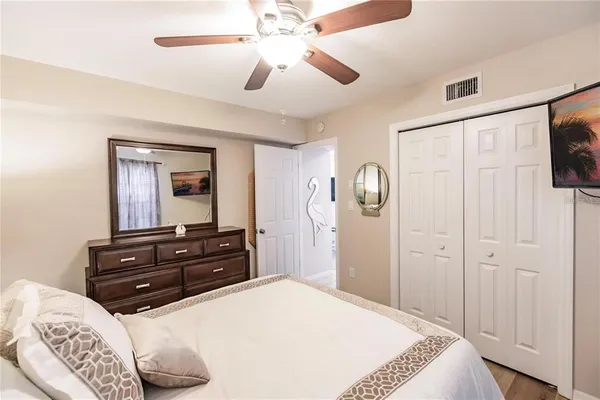 a bedroom with a bed and a dresser