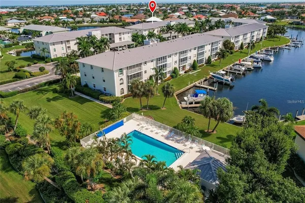 an aerial view of multiple houses with yard
