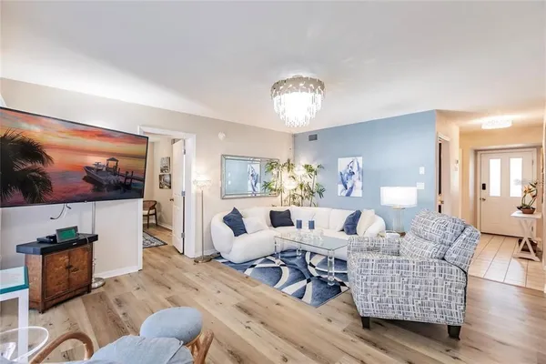 a living room with furniture and a flat screen tv