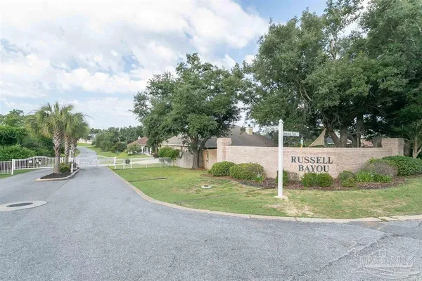 a garden with trees in the background