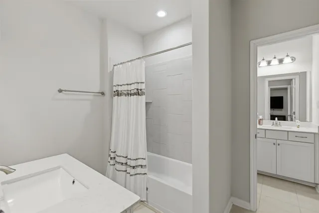 a bathroom with a bathtub and a sink