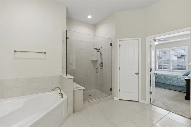 a bathroom with a bathtub and a shower