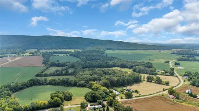 an aerial view of a house with a garden