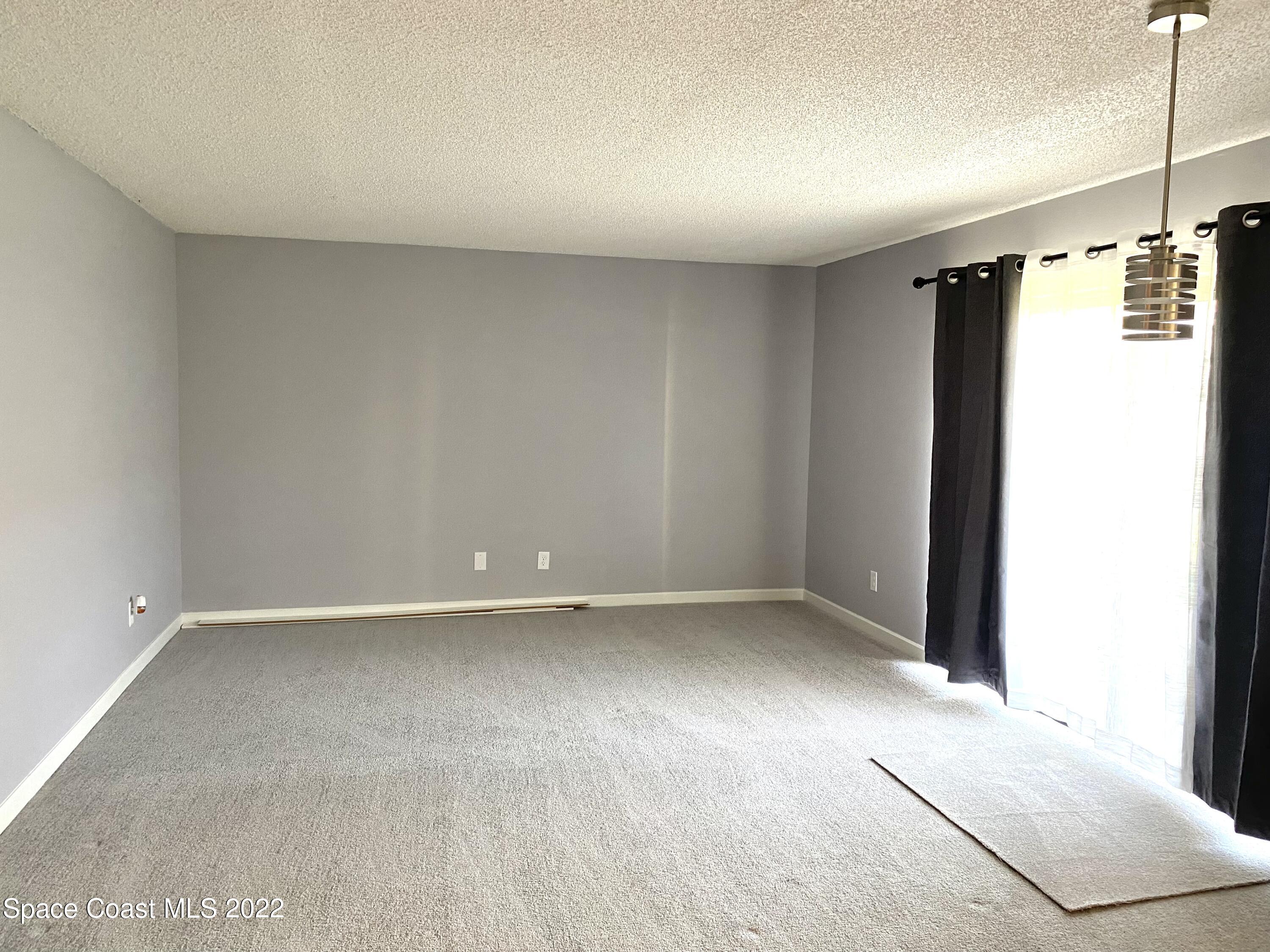 590 North Wickham Road, Unit 21 Melbourne, FL 32935 - Photo 4 of 13 Living room/dining room