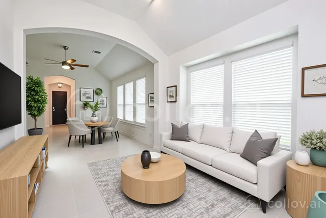 a living room with furniture and a large window