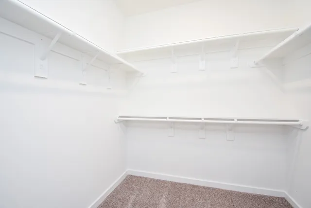 a view of an empty walk in closet