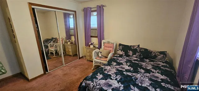 a bed room with a bed and a window