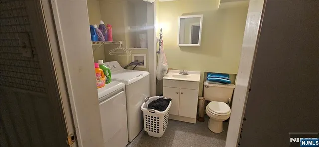 a bathroom with a toilet and a sink