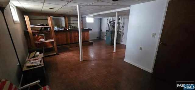 a view of a gallery with wooden floor