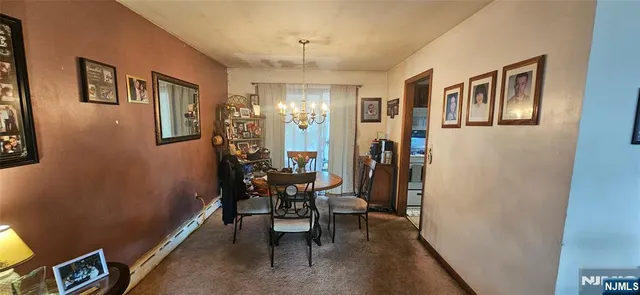 a view of a livingroom with furniture and a window