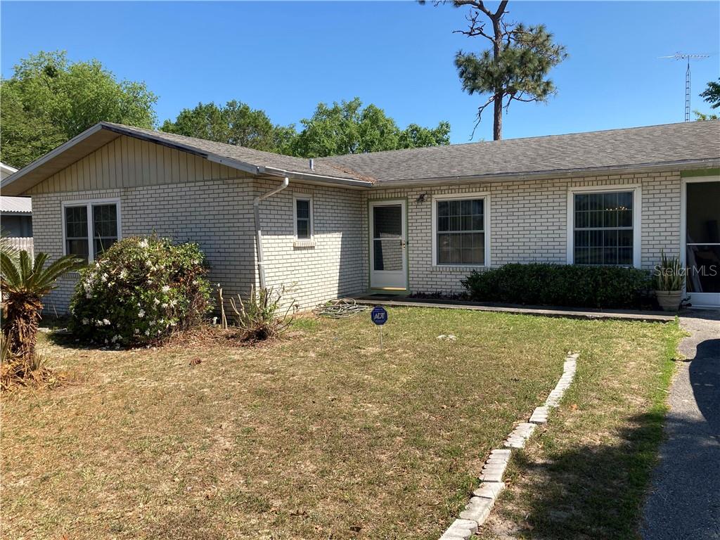 a house view with a garden space