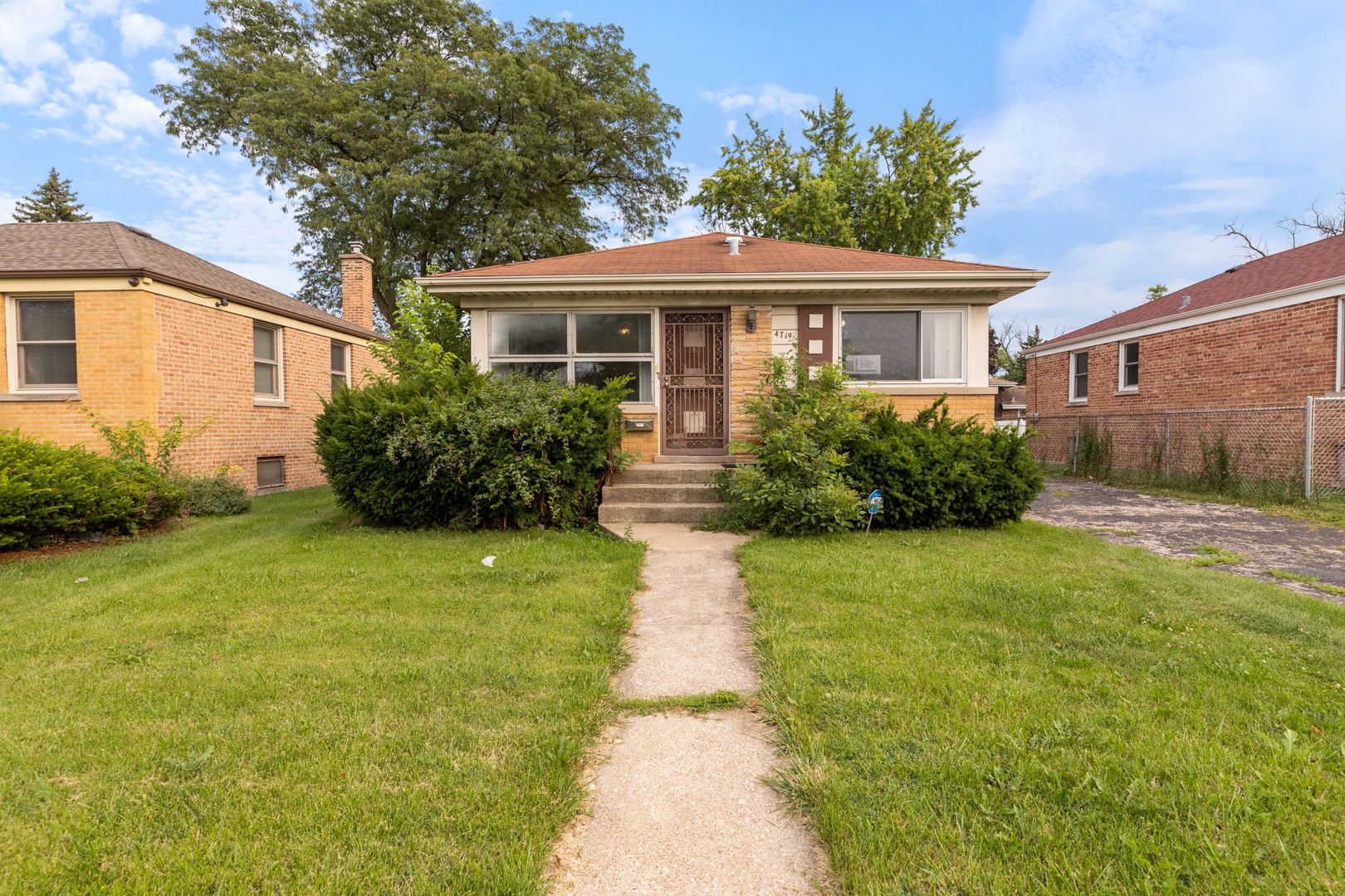 4719 Butterfield Road Hillside, IL 60162 - Photo 1 of 15 a front view of house with yard and green space