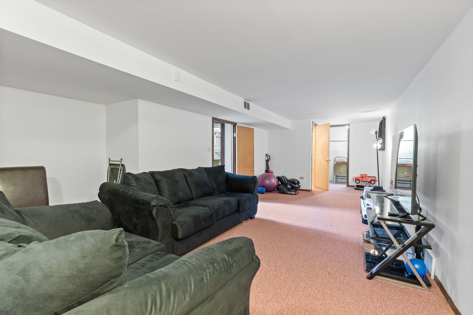 4719 Butterfield Road Hillside, IL 60162 - Photo 13 of 15 a living room with furniture a couch and wooden floor