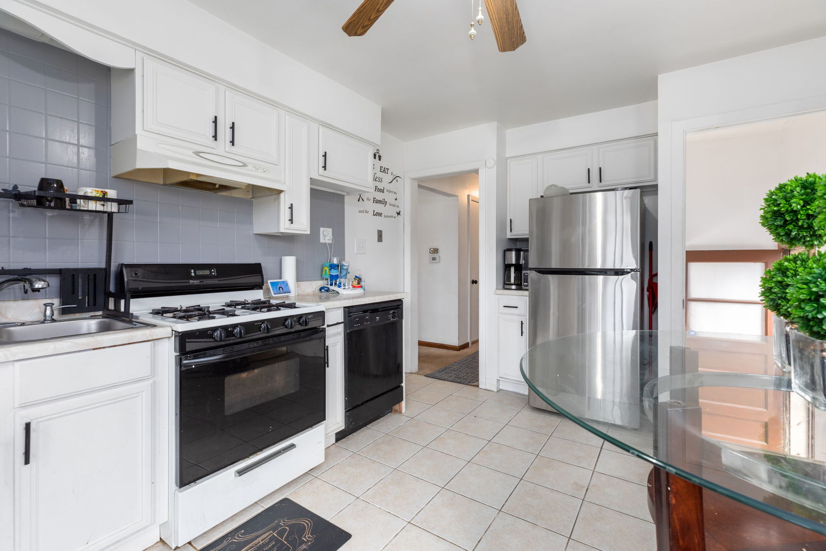 4719 Butterfield Road Hillside, IL 60162 - Photo 6 of 15 a kitchen with stainless steel appliances granite countertop a stove a refrigerator and a cabinets