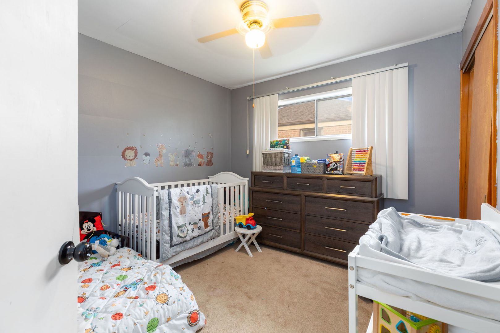 4719 Butterfield Road Hillside, IL 60162 - Photo 9 of 15 a bedroom with two beds and a window