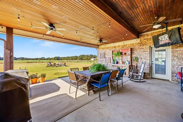 a view of a patio with swimming pool