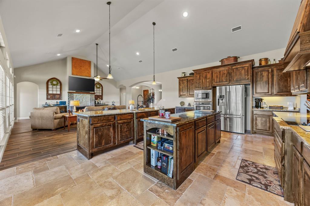 454 Farr Altom Road Seagoville, TX 75159 - Photo 15 of 29 a kitchen with stainless steel appliances granite countertop a stove a sink a oven and a refrigerator