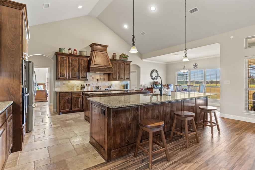 454 Farr Altom Road Seagoville, TX 75159 - Photo 18 of 29 a large kitchen with a table and chairs