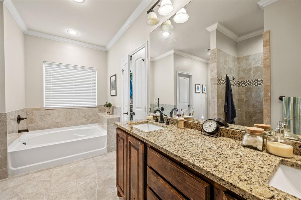454 Farr Altom Road Seagoville, TX 75159 - Photo 19 of 29 a bathroom with a granite countertop bathtub sink vanity and mirror