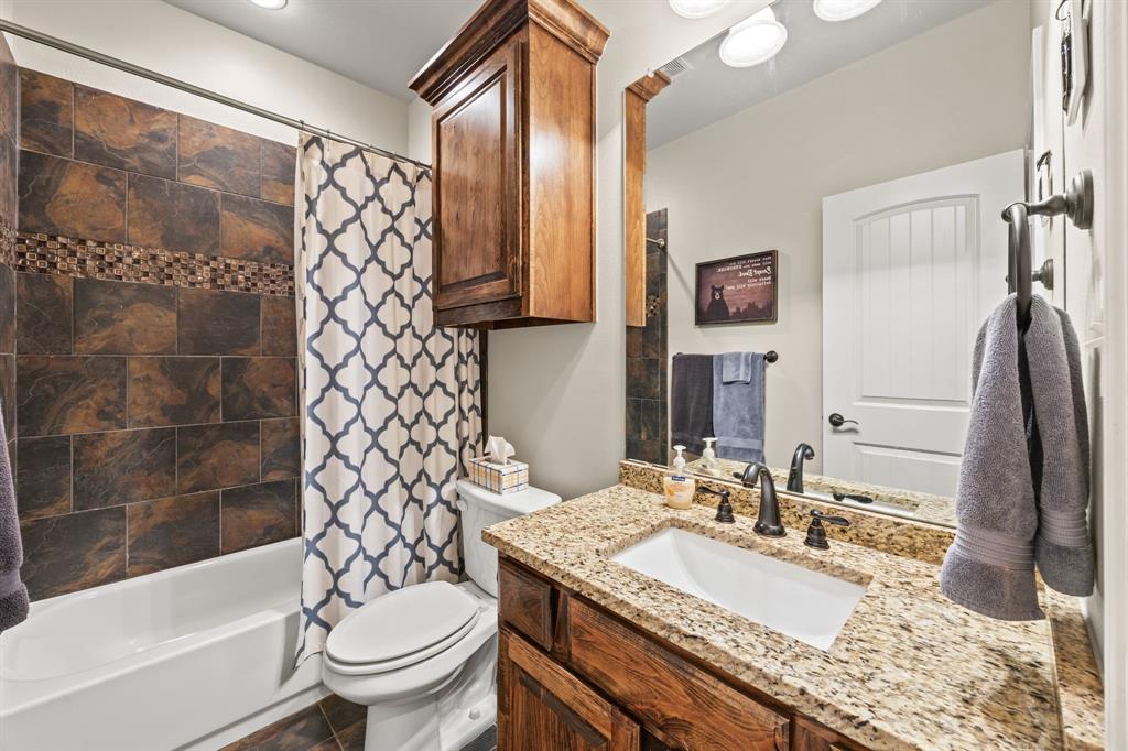 454 Farr Altom Road Seagoville, TX 75159 - Photo 25 of 29 a bathroom with a granite countertop sink toilet and shower