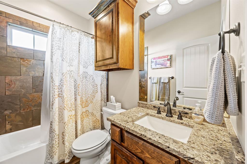 454 Farr Altom Road Seagoville, TX 75159 - Photo 26 of 29 a bathroom with a granite countertop sink toilet and shower