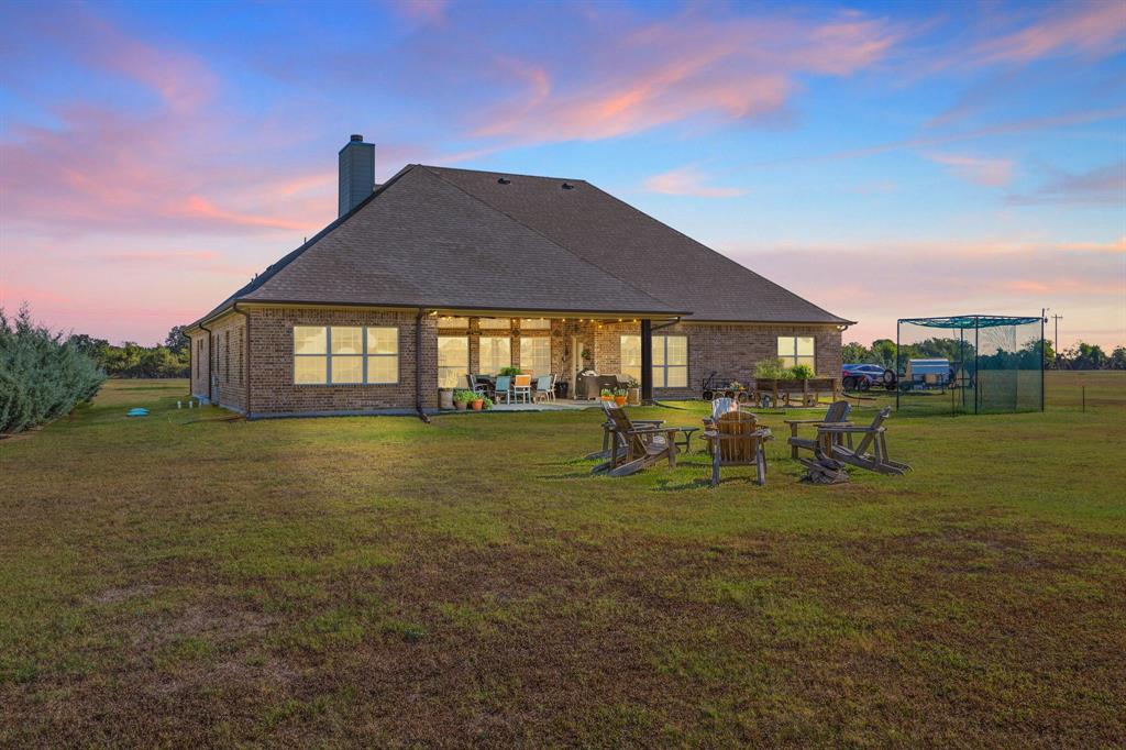 454 Farr Altom Road Seagoville, TX 75159 - Photo 27 of 29 a front view of house with outdoor seating and green space