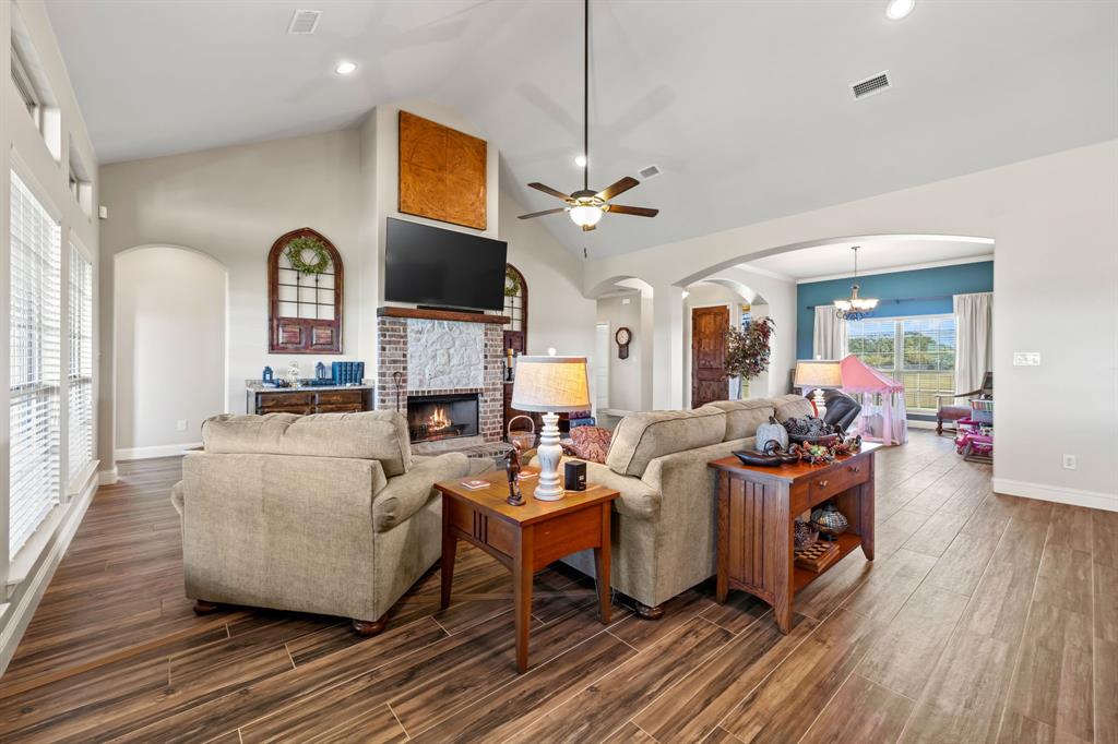 454 Farr Altom Road Seagoville, TX 75159 - Photo 3 of 29 a living room with fireplace furniture and a flat screen tv