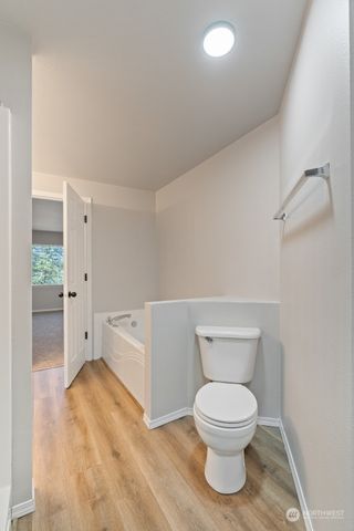 a white toilet sitting next to a bathroom sink