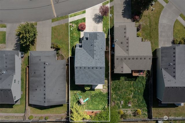 aerial view of a house with a garden