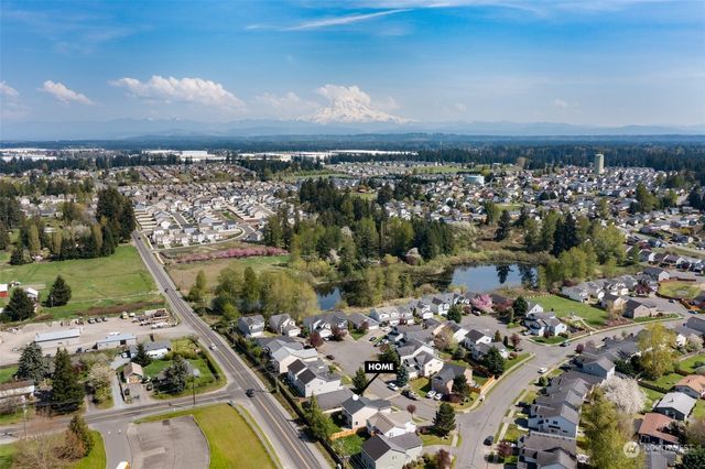 a picture of a bench in front of a building