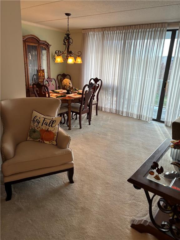 1160 Bower Hill Road, Unit 312B Mt. Lebanon, PA 15243 - Photo 8 of 13 a living room with furniture and a chandelier