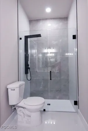a bathroom with a double vanity sink and mirror