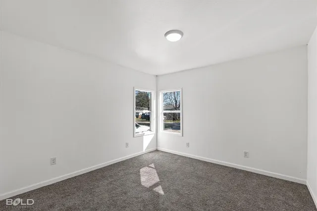 an empty room with a empty space and window