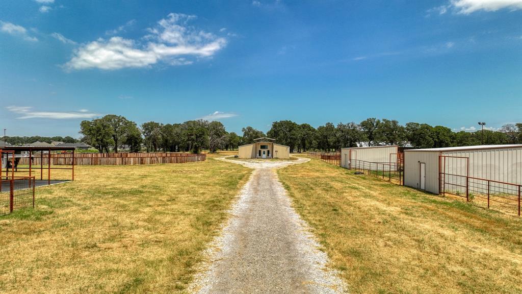 990 Doss Road Millsap, TX 76066 - Photo 13 of 40 a swimming pool with an outdoor seating