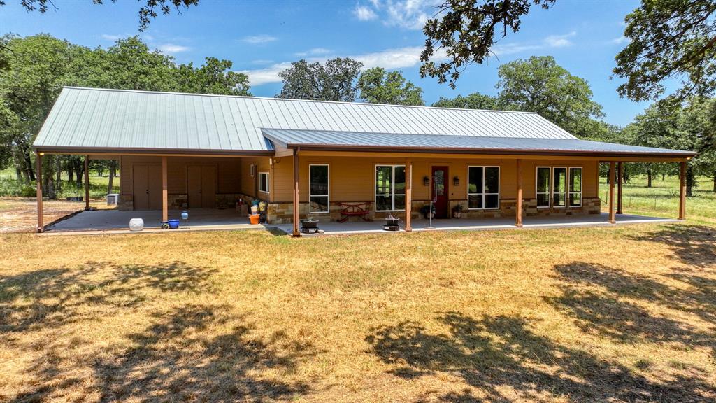 990 Doss Road Millsap, TX 76066 - Photo 14 of 40 front view of a house with a patio