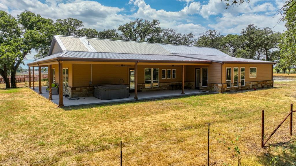 990 Doss Road Millsap, TX 76066 - Photo 15 of 40 a view of the house with a patio