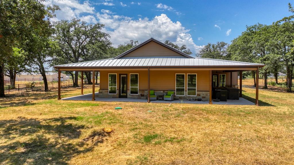 990 Doss Road Millsap, TX 76066 - Photo 16 of 40 a front view of a house with a yard