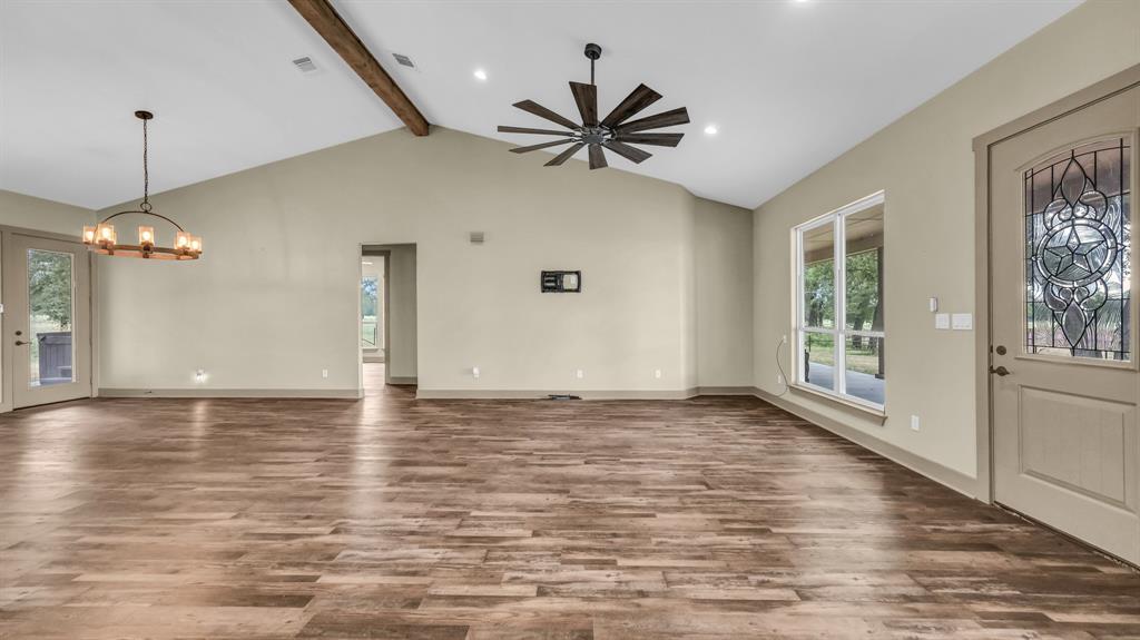 990 Doss Road Millsap, TX 76066 - Photo 18 of 40 a view of a livingroom with a ceiling fan and window
