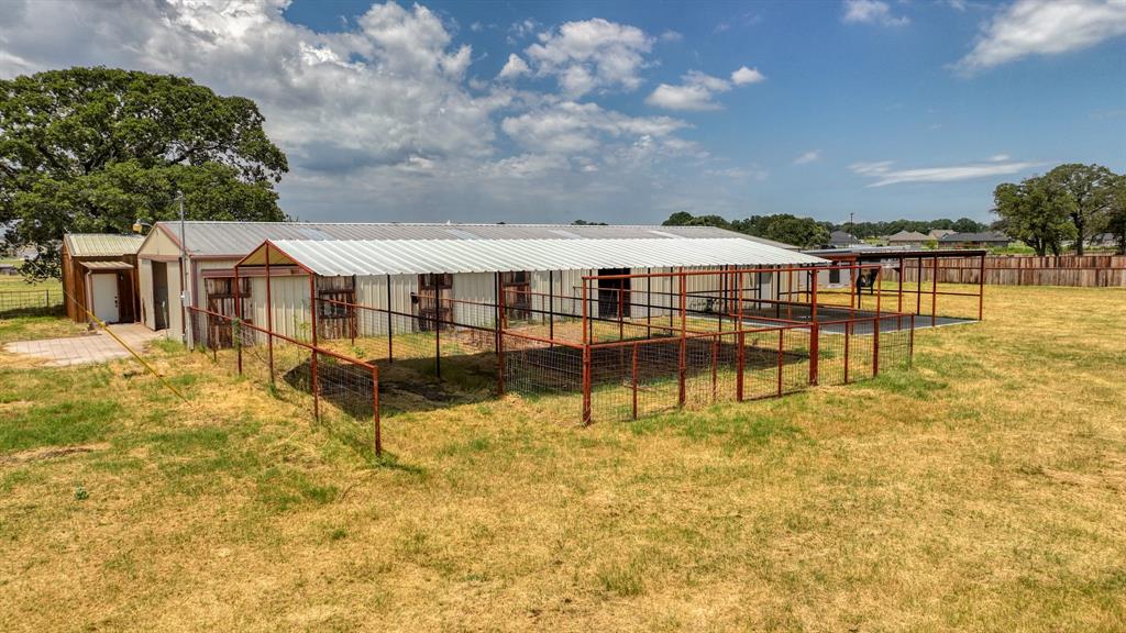990 Doss Road Millsap, TX 76066 - Photo 33 of 40 a swimming pool with outdoor seating and yard